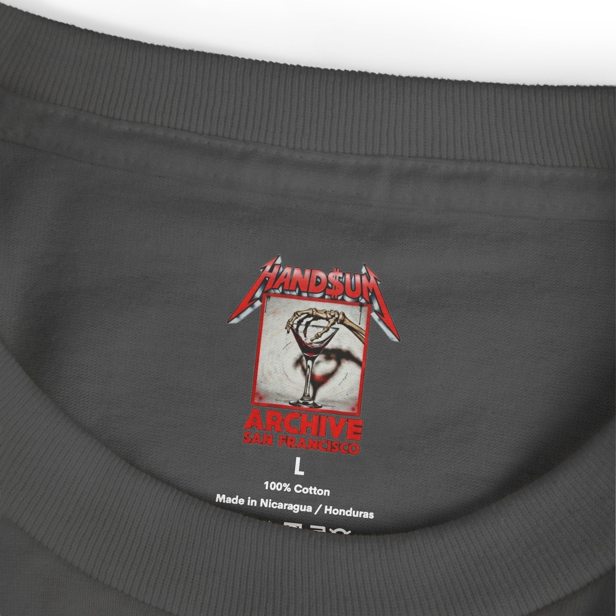 Dark gray T-shirt neckline close-up with size L and 100% cotton label