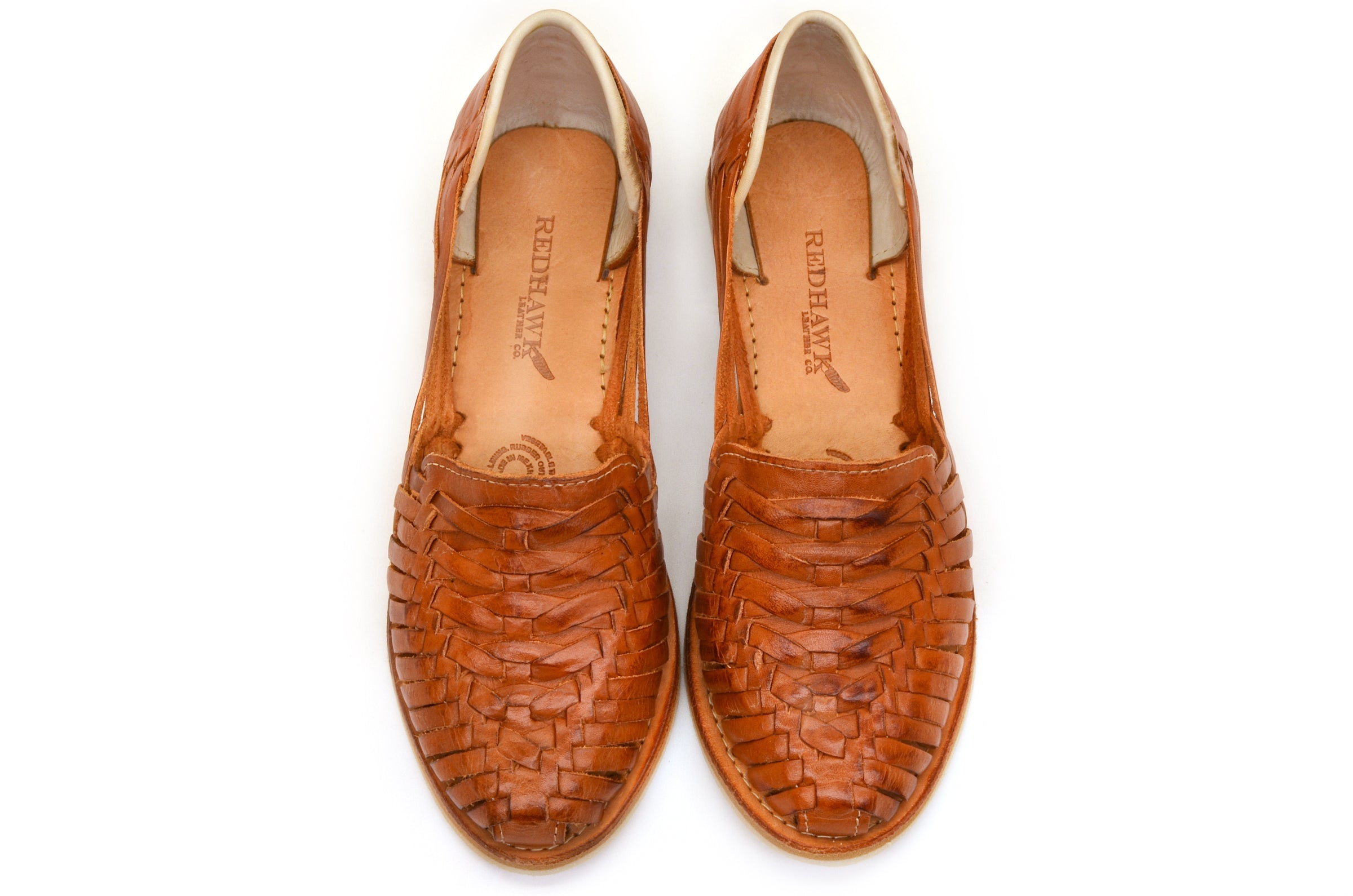 Brown leather huarache flats with woven pattern, rounded toe, and tan insole