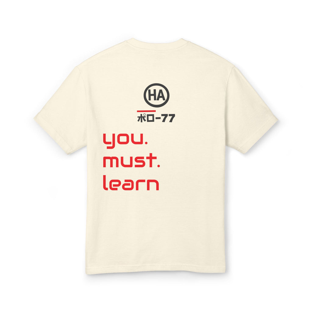 Cream back graphic T-shirt with circular logo and red text "you. must. learn"