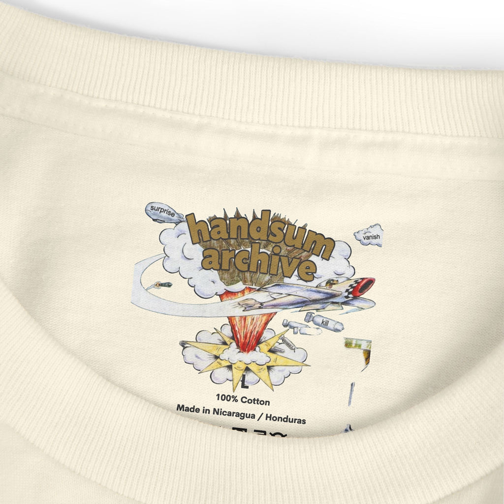 Cream tee hem close-up with “100% Cotton” and “Handsum Archive” print.