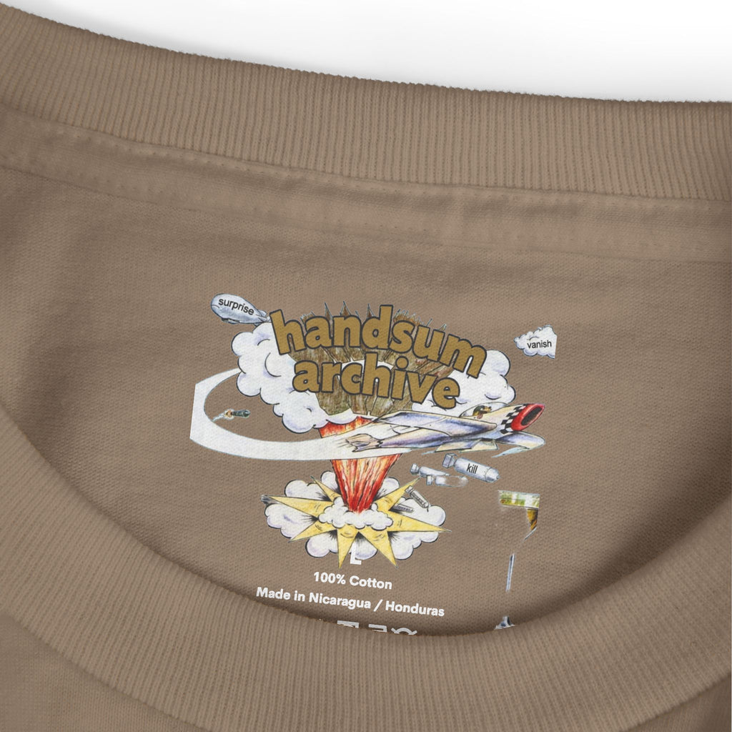 Brown tee hem close-up with “100% Cotton” and “Handsum Archive” print.