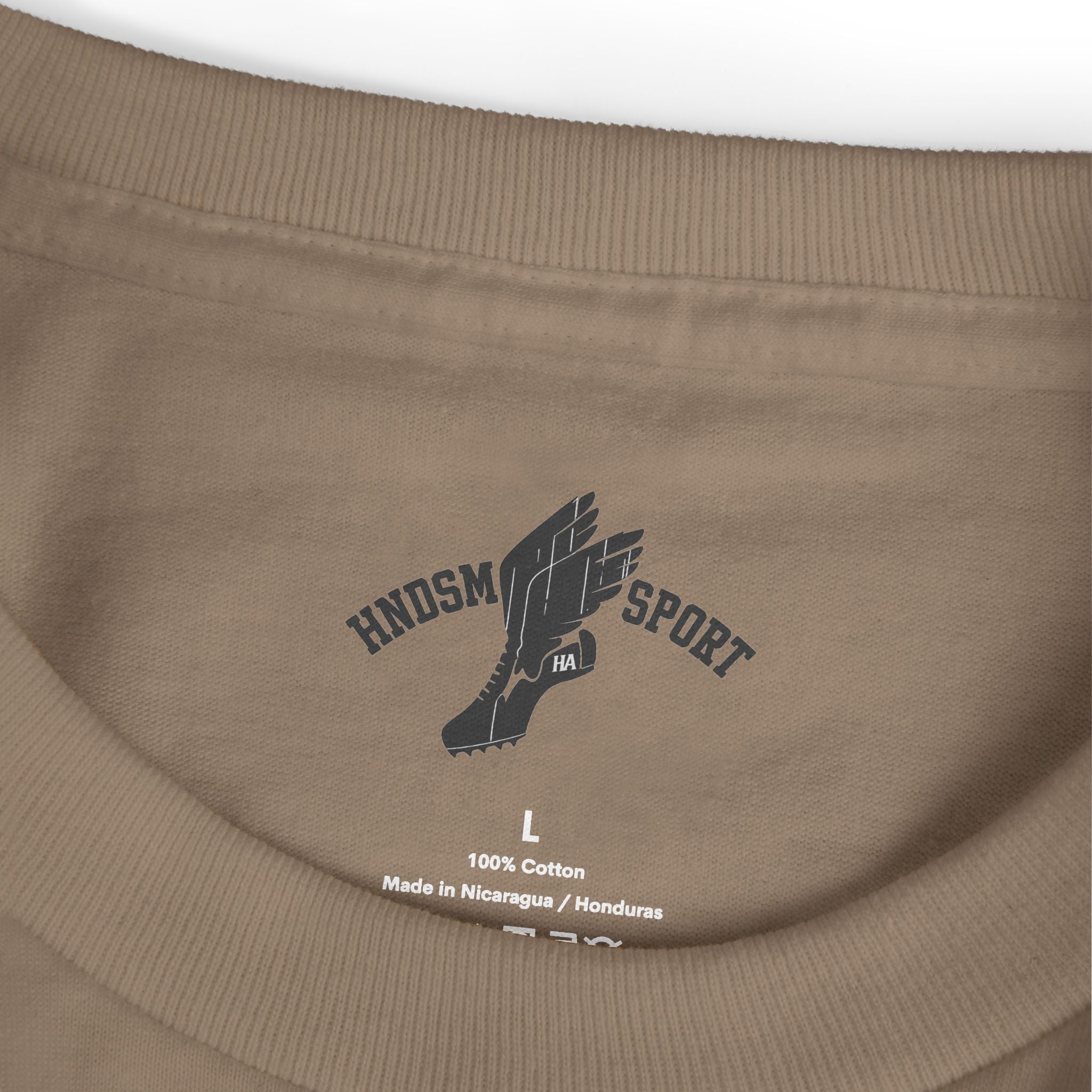 Brown daily tee close-up with neck label and size L, 100% cotton