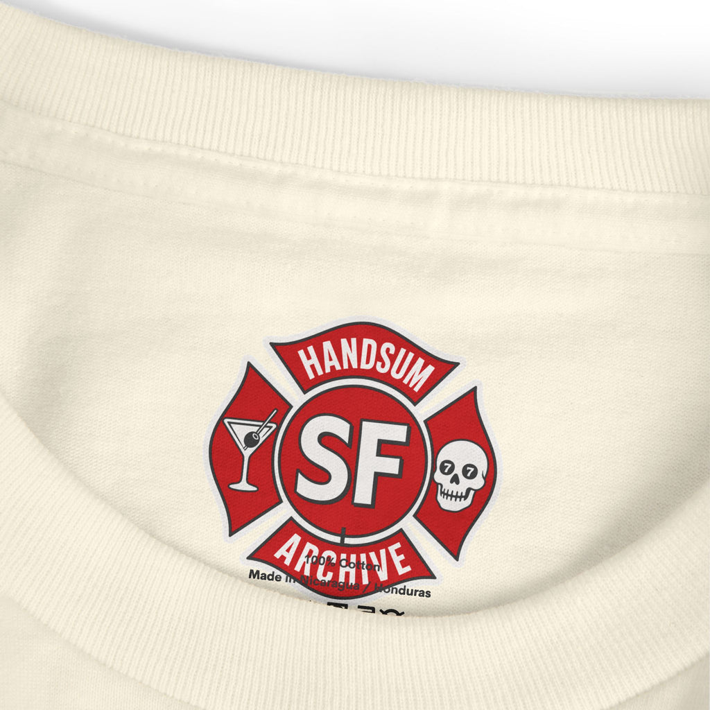 Cream crew-neck tee with round SF brand logo patch at neckline