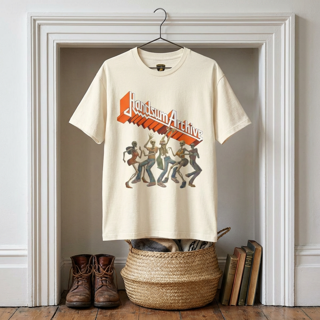 Faded cream graphic tee, front logo and character illustration on hanger