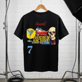 Black graphic tee with skull-yacht cocktail collage and blue '7' on back