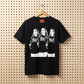Black T-shirt with front graphic of three women in black tops and white pants.
