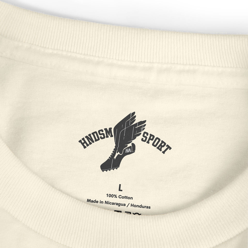 Cream tee close-up of ribbed crew neck and front logo print; size tag visible