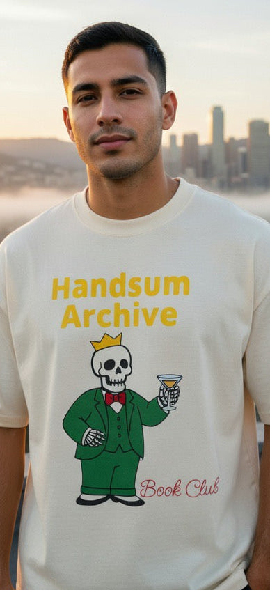 King Babar Tee, cream, skull reader holding trumpet graphic, front view