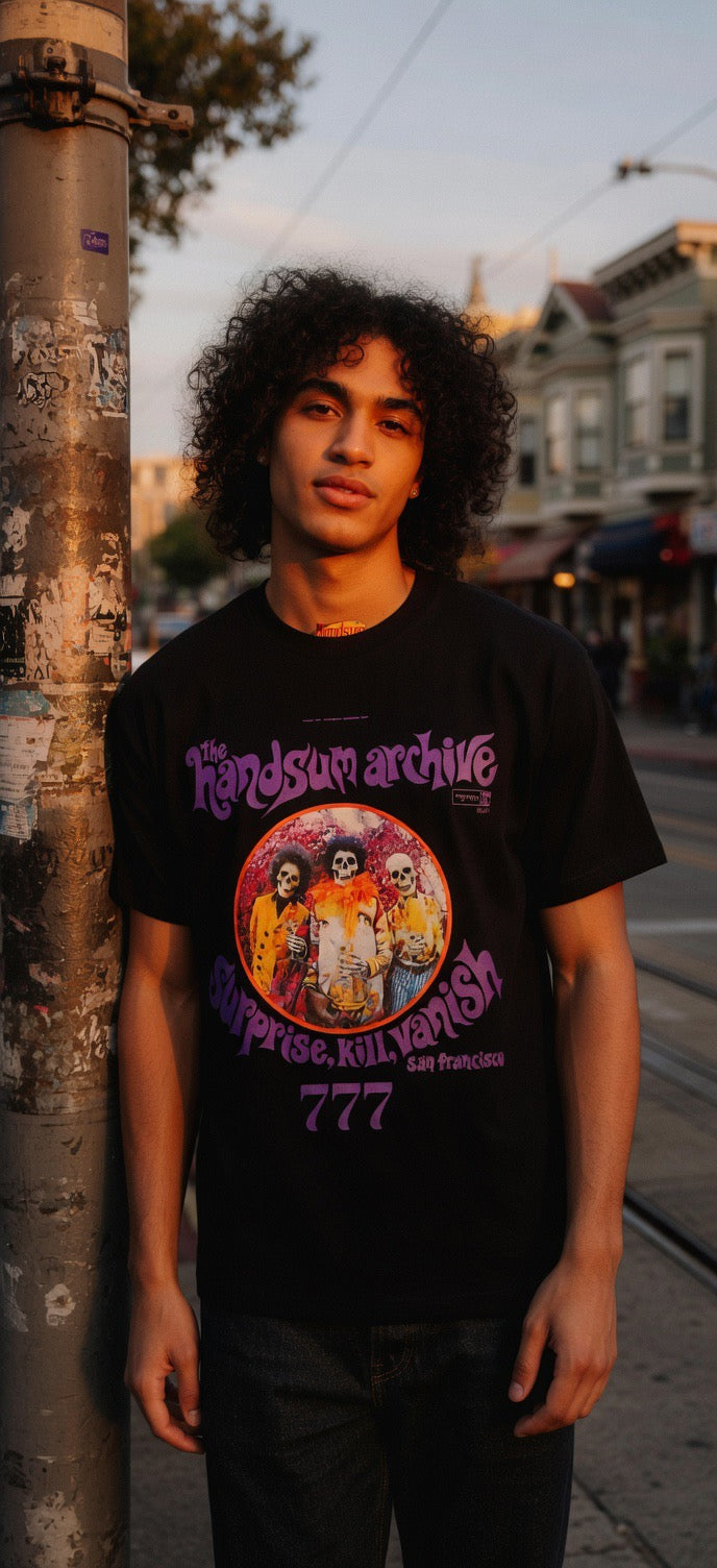 Black T-shirt with purple graphic logo and skull circle print, short sleeves