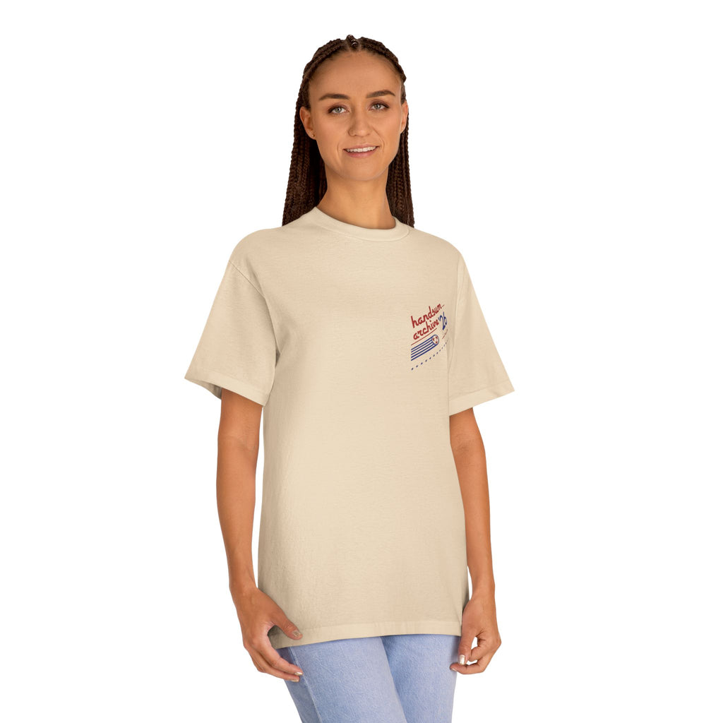 Cream crewneck T-shirt with small chest logo graphic print.