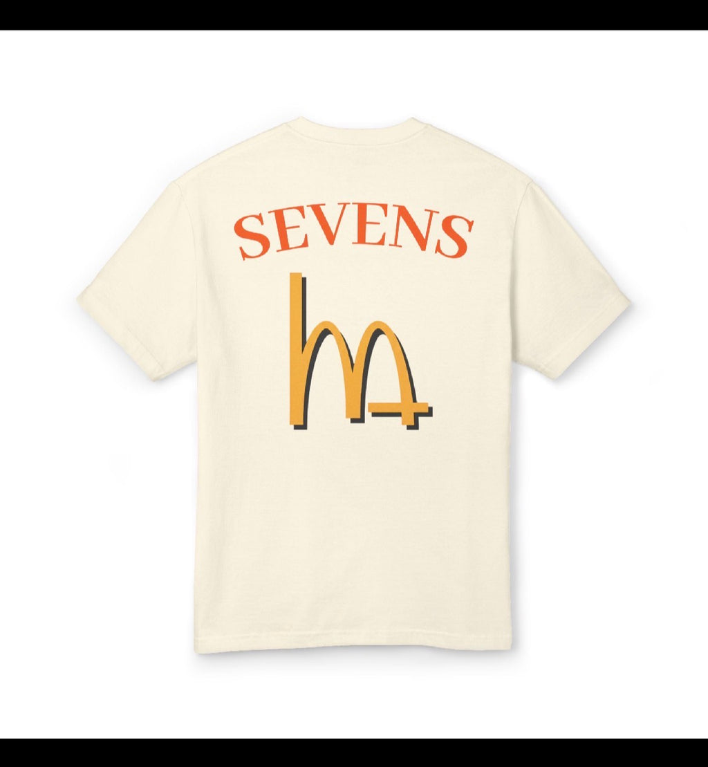 Faded cream graphic party tee with SEVENS logo and yellow arches