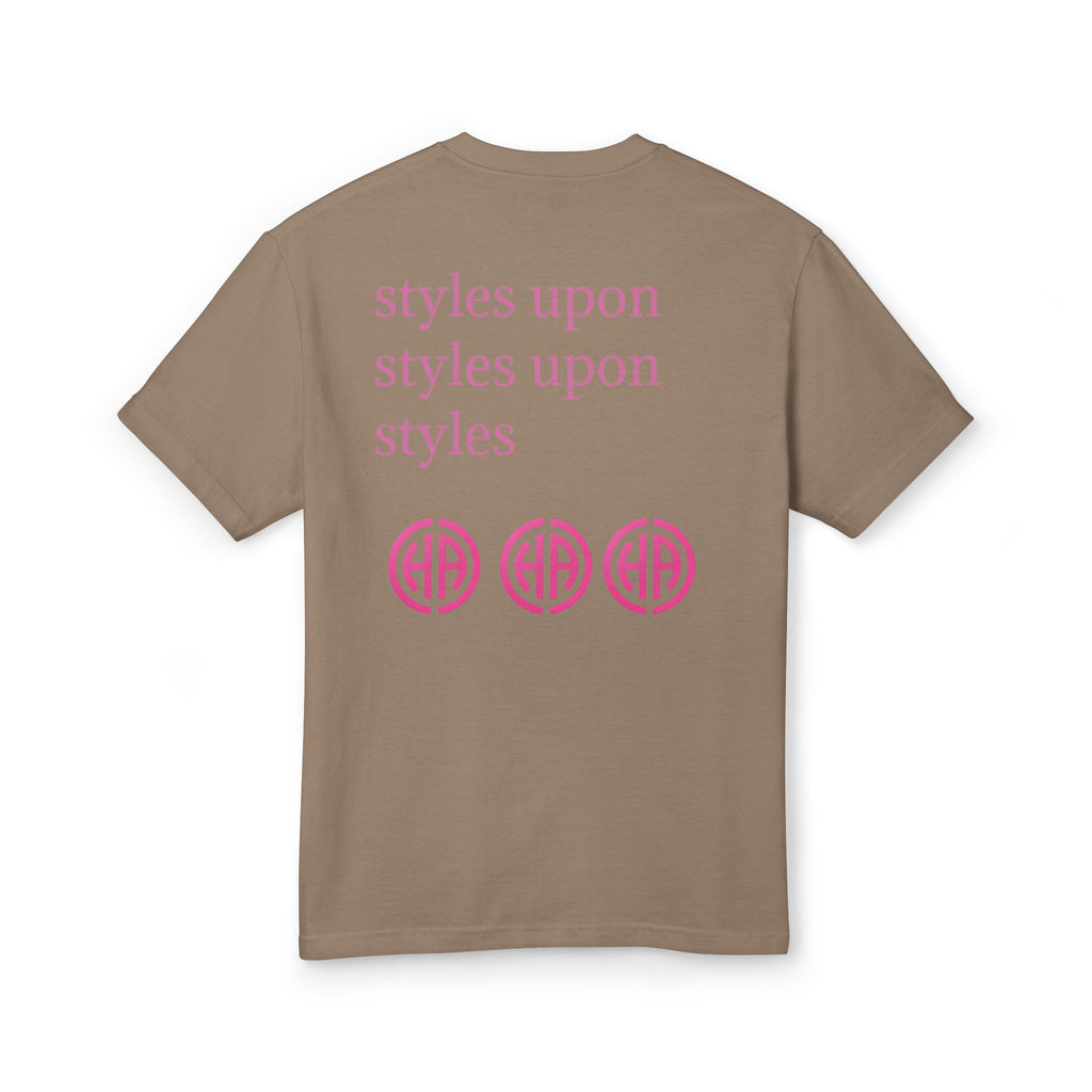 Faded brown T-shirt back with pink text styles upon styles upon and circular logo