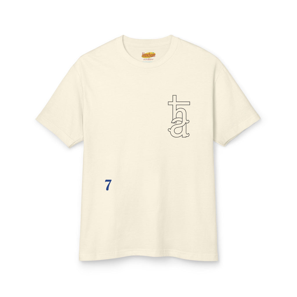 Cream graphic T-shirt front with tall monogram and small blue number 7