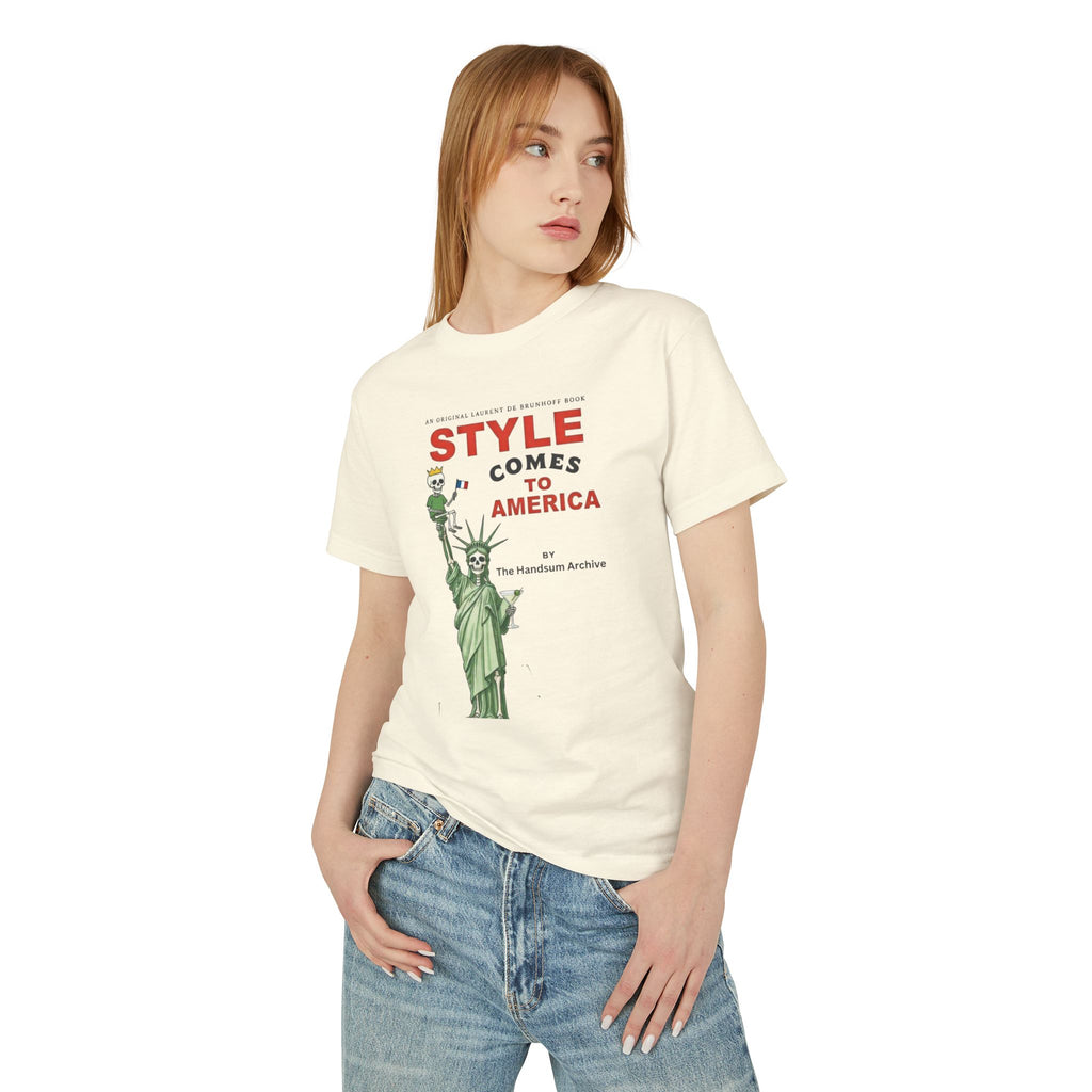 Cream Statue of Style tee with front graphic worn with blue jeans
