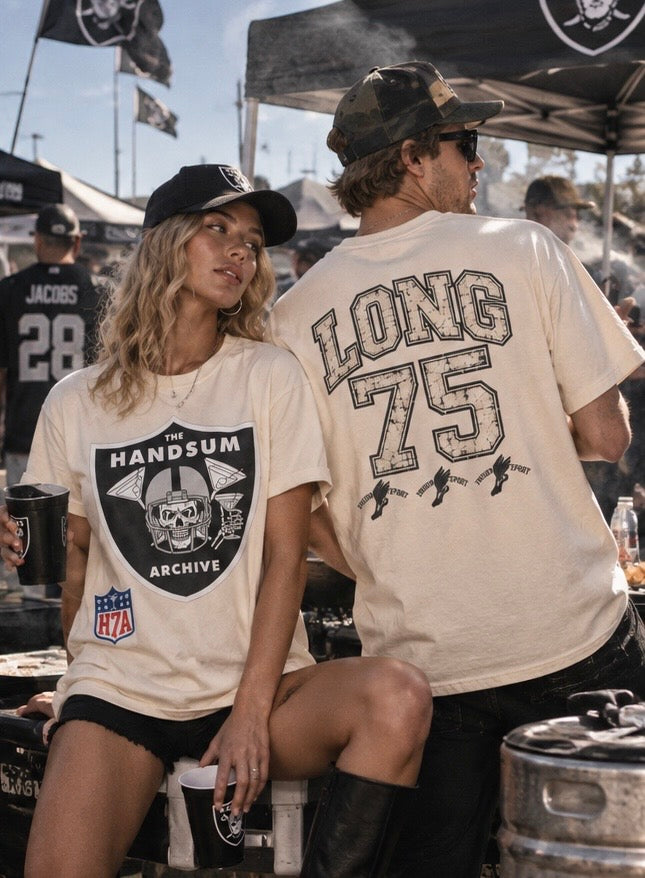 Two people wearing cream tees: 'THE HANDSUM ARCHIVE' chest graphic and 'LONG 75' back print