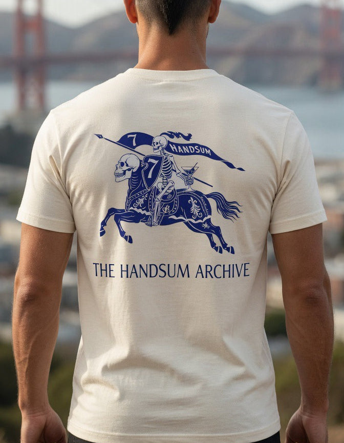 Cream graphic T-shirt with blue horse rider and 'THE HANDSUM ARCHIVE' on back
