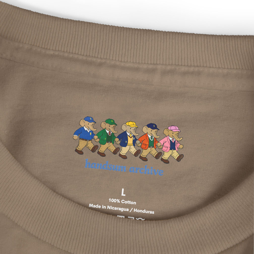Beige cotton neck label with illustrated artwork and size "L"