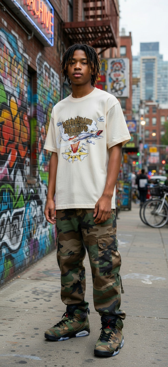 Cream handsum archive graphic tee with character illustration across the chest