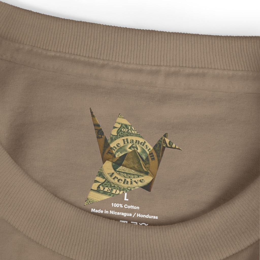 Faded brown T-shirt neckline with 100% cotton label and “Made in Nicaragua / Honduras”