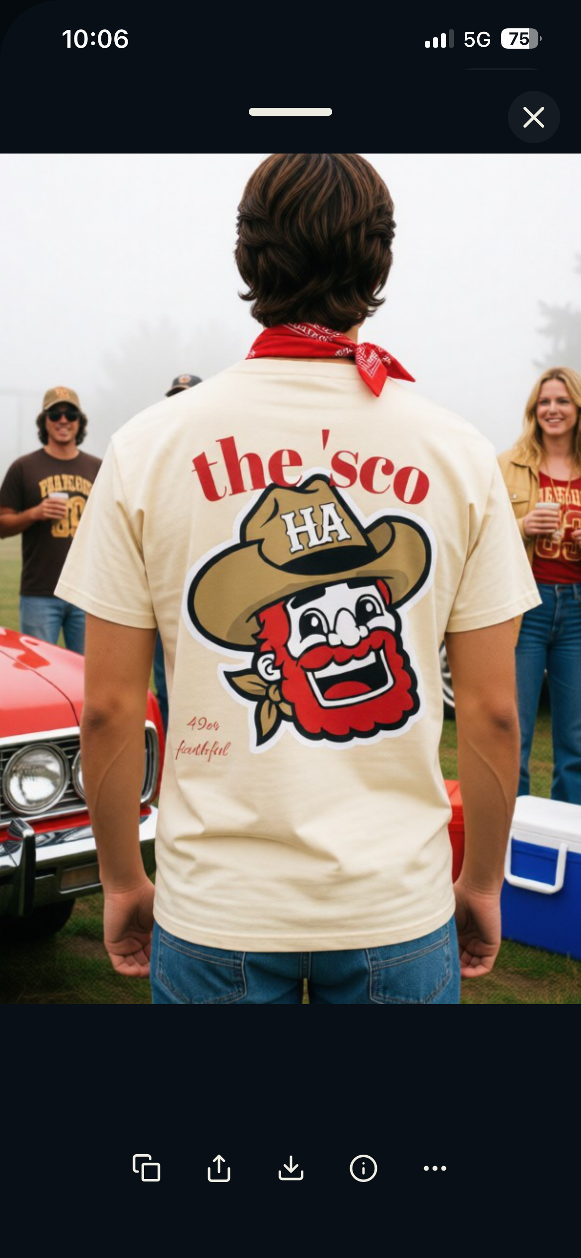 Cream T-shirt back view with "the'sco" text and cartoon mascot graphic