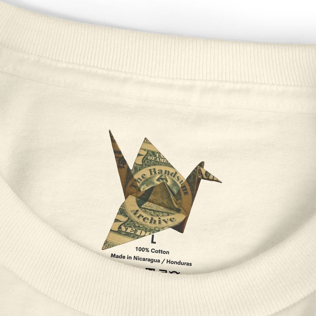 Cream T-shirt neckline with 100% cotton label and “Made in Nicaragua / Honduras”