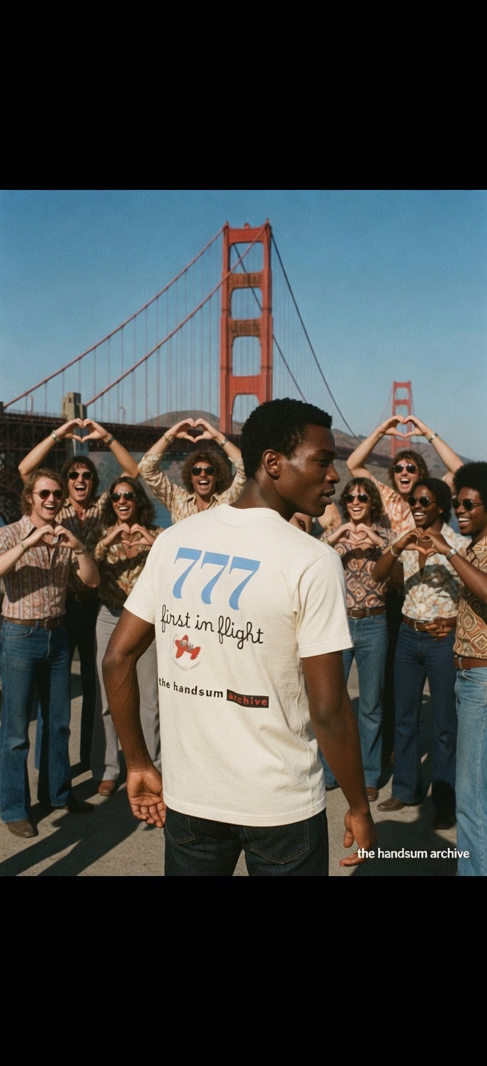First in Flight tee, cream crewneck with blue 777 and text graphic on back