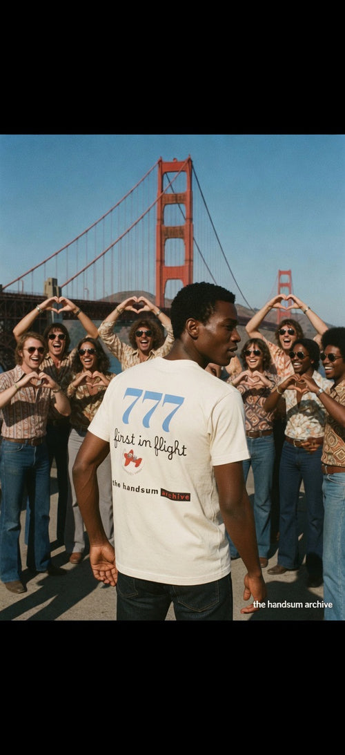 First in Flight tee, cream crewneck with blue 777 and text graphic on back