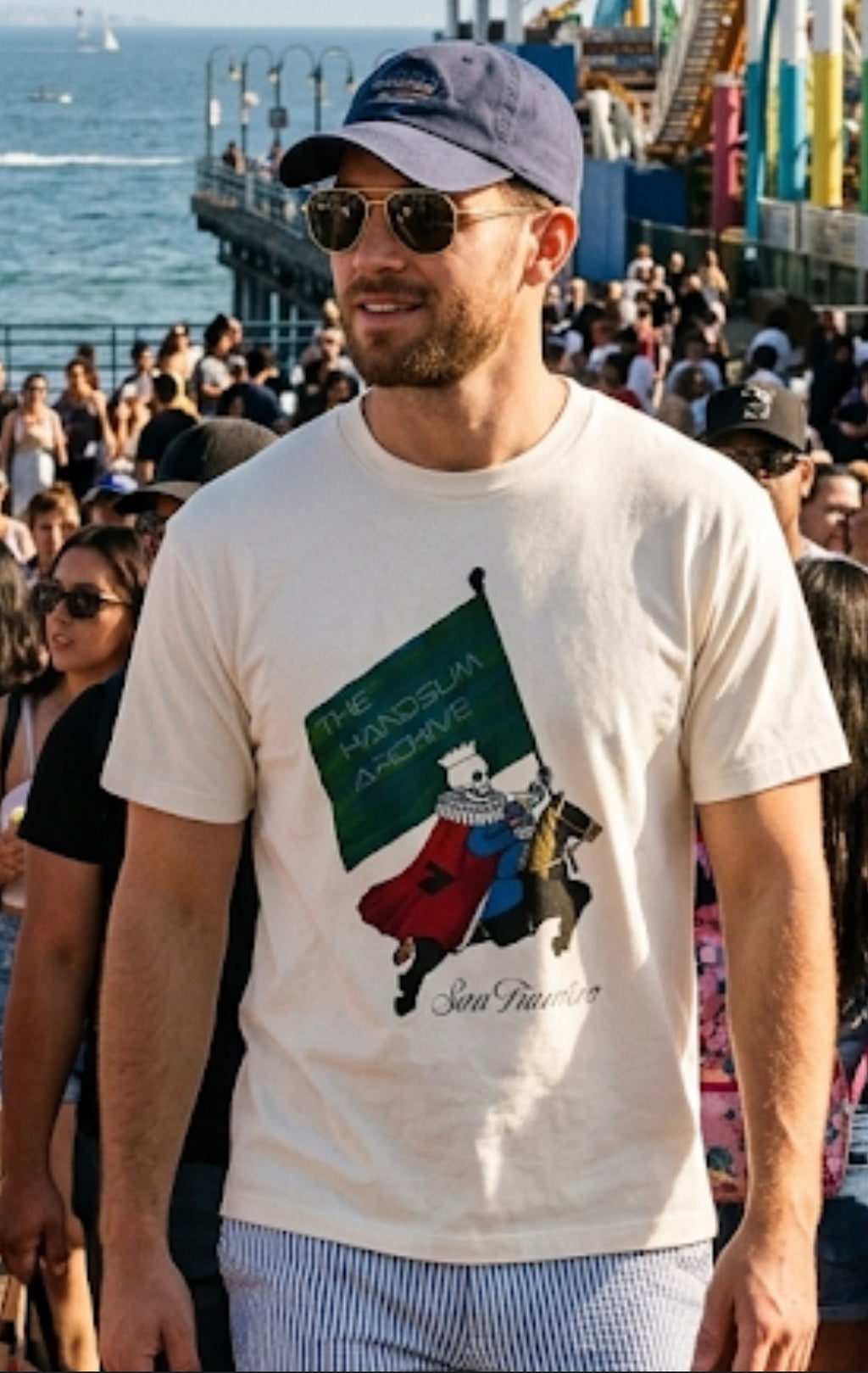 White crewneck tee with colorful knight logo graphic on the front.