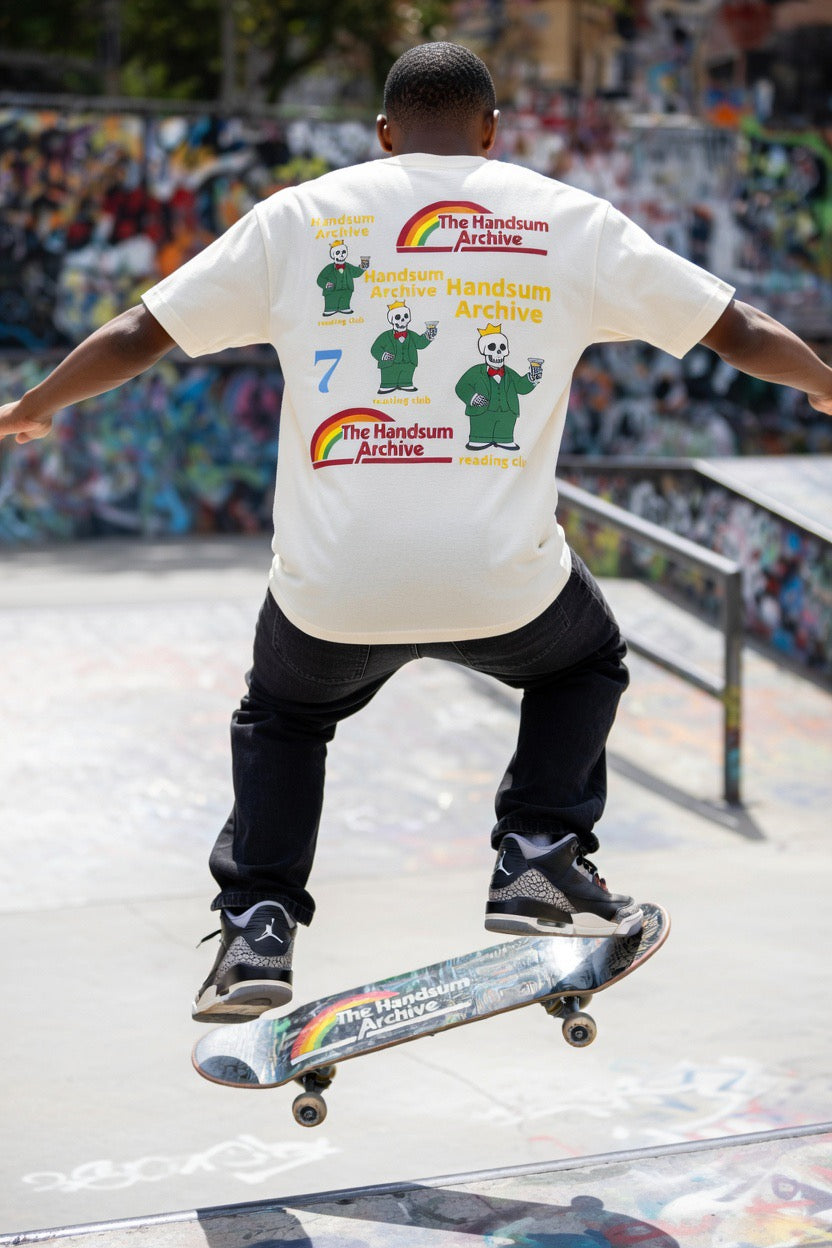 Faded cream T-shirt back print with 'The Handsum Archive' logos and cartoon skeletons