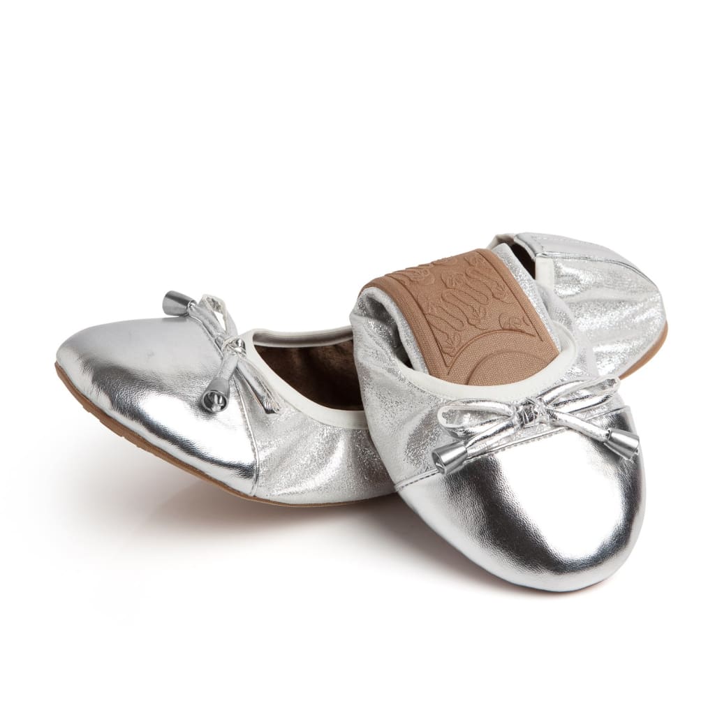 Silver metallic flats with bow-tie detail at the toe and low flat sole