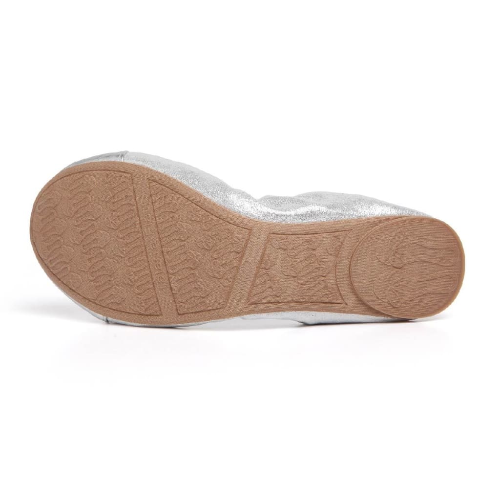 Silver metallic flats viewed from the outsole, showing textured tread
